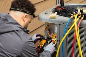 Tech repairing heat pump
